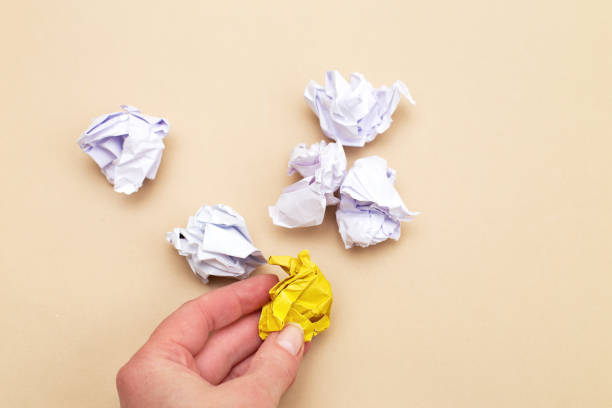 istock crumpled yellow and white paper as a concept creative idea and innovation 1481964799