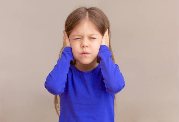 istock Child with closing ears by hands with closed eyes 1481972226