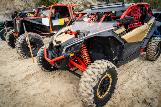 istock Cool quads stand in a row on sand before competition 1481972617