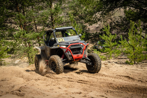 istock UTV, ATV, 4x4 off road vehicle in sandy open area. Buggy extreme riding 1481972618