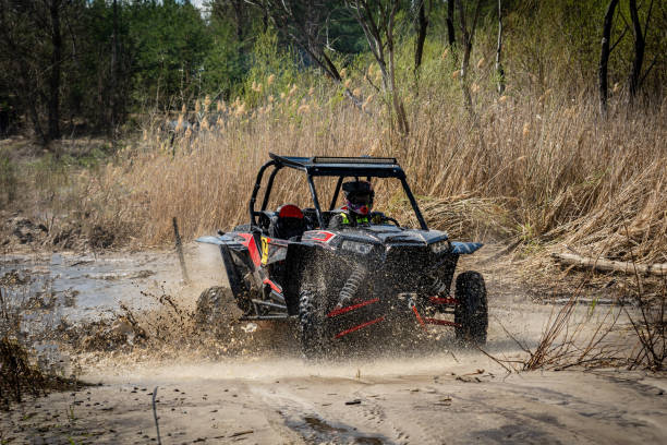 istock Active ATV and UTV Off-Road vehicle in muddy water. ATV 4x4 1481972640