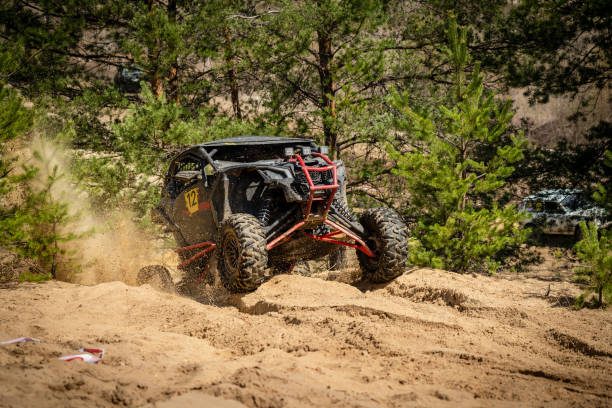 istock UTV, ATV, 4x4 off road vehicle in sandy open area. Buggy extreme riding 1481972643