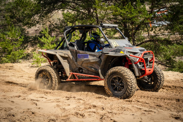 istock UTV, ATV, 4x4 off road vehicle in sandy open area. Buggy extreme riding 1481972652