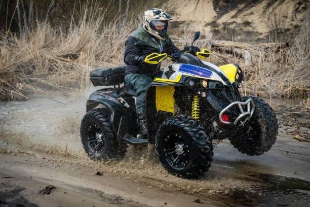 istock Fast ATV and UTV driving in mud and water. Quad racing, ATV 4x4. 1481972692
