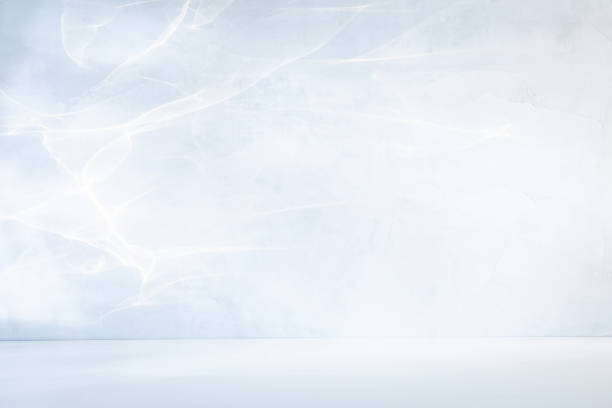 istock White table top or floor and concrete wall with beautiful play of light on it. Background for product presentation 1481990049