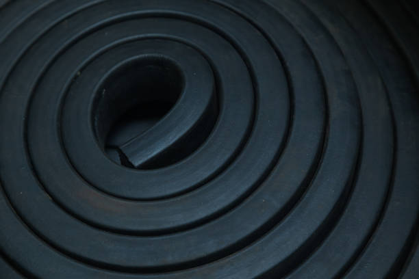 istock Close-up rubber sealing strips for waterproof doors. A pile of rubber twisted into rolls. 1481996088