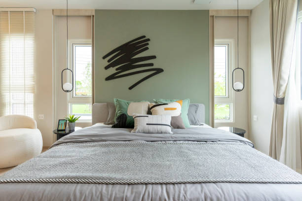 istock Modern bedroom interior with green wall and wall art. 1481996827