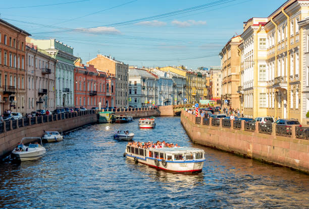 Boats sailing along Moyka river, St. Petersburg, Russia Boats sailing along Moyka river, St. Petersburg, Russia pushkin st petersburg stock pictures, royalty-free photos & images