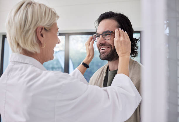 istock Optician, glasses and man in store for vision, eyesight and optical frames. Happy customer face, optometrist and lenses for eye care test, healthcare consulting and retail shop services for wellness 1482000008