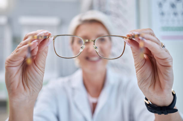 Optometry person putting glasses on in client face pov for consultation, frame check and vision test in store. Customer services, help and support of professional worker or person lens eyes care persona de optometría que se pone gafas en el pov de la cara del cliente para consulta, verificación de marco y prueba de visión en la tienda. servicios al cliente, ayuda y apoyo del profesional trabajador o persona del cuidado de los ojos del cristalin