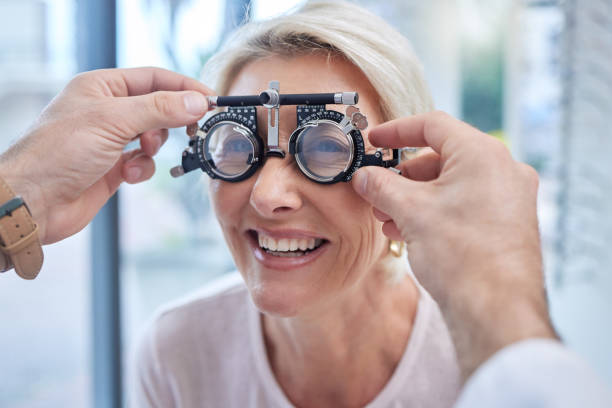 istock Happy customer in a vision test or eye exam for eyesight by doctor, optometrist or ophthalmologist with medical aid. Hands, helpful or optician consulting a senior woman to see or check glaucoma 1482000134