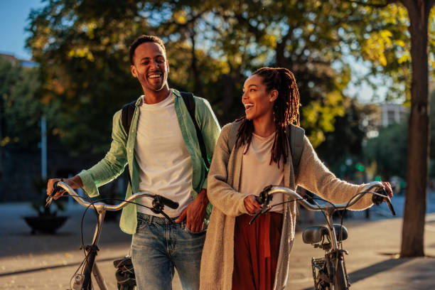 istock Cheerful couple with bicycles in city. 1482000892