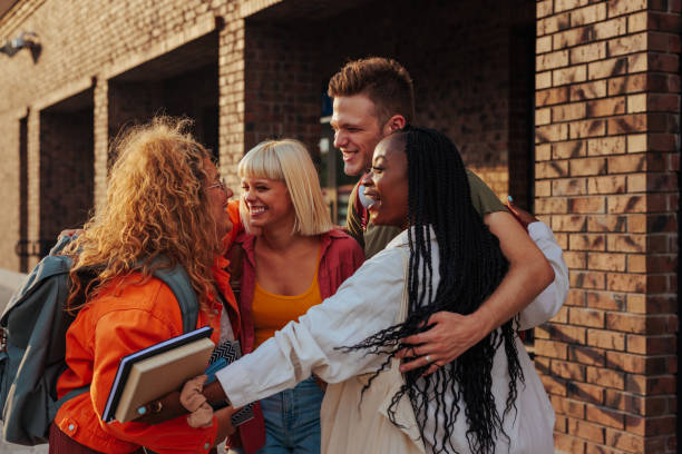 istock Students reunited after summer break. 1482001559
