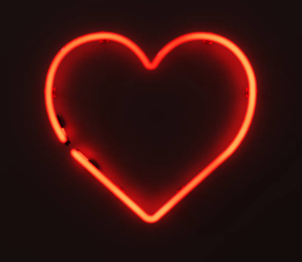 istock Centered Glowing 3D Rendered Neon Heart Sign On Wall 1482001697