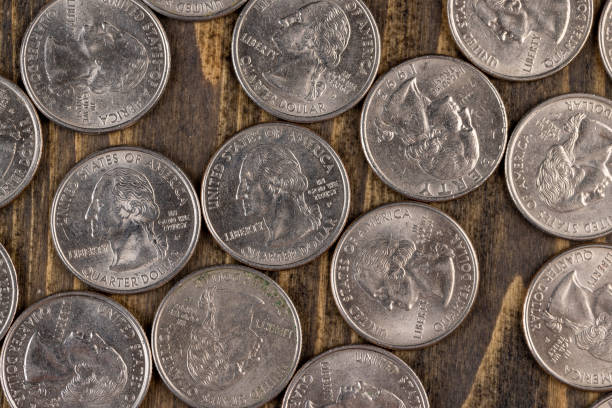 istock old American quarter dollar coins, close-up 1482002033