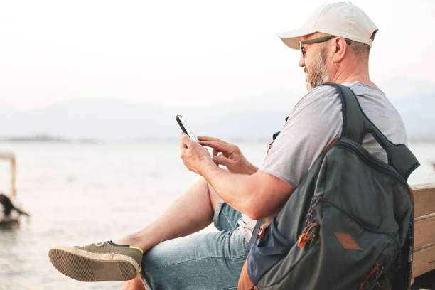 istock mature adult man resting on the beach 1482002394