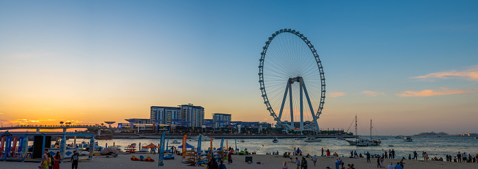 Dubai, United Arab Emirates - April 4, 2023: Giant Ain Dubai Wheel, Luxury Hotels, Blue Waters Island, JBR and Dubai Marina. panorama