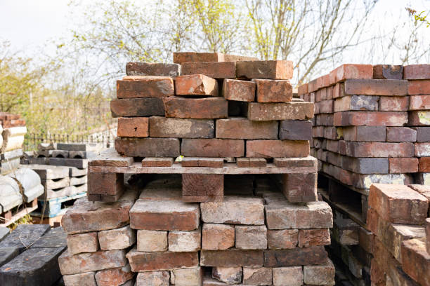 Reclamation yard background: rows of bricks on the pallets,