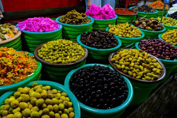 istock Selection of assorted olives, featuring a colorful array of green, black, and purple varieties 1482007633
