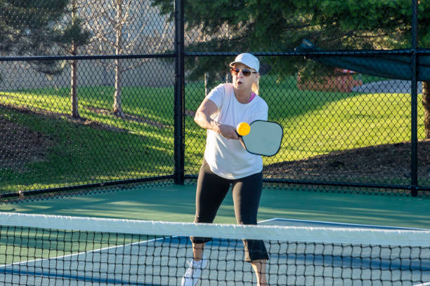 istock Female Pickleball Player Returns Ball 1482008357