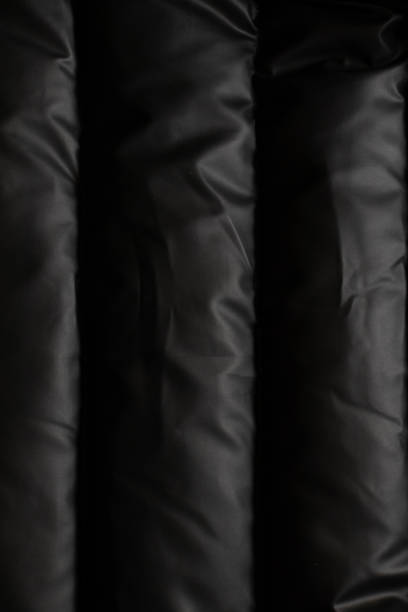 istock background of a black puffer jacket close up 1482009179
