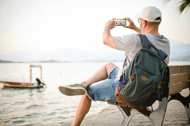 istock mature adult man resting on the beach 1482009643