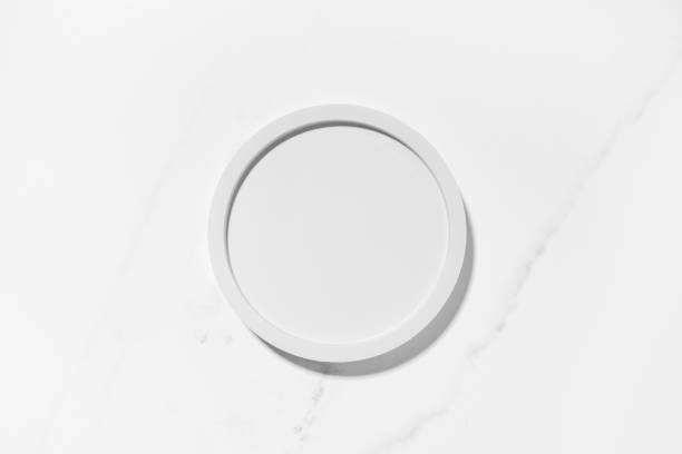 istock Beauty cosmetics product presentation flat lay mockup scene with white circle shape on white marble table with copy space. Trendy sunlight,  top view. Studio photography. 1482016010