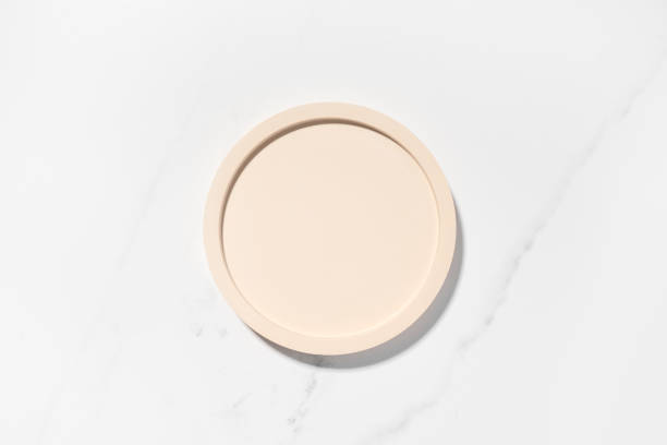 istock Beauty cosmetics product presentation flat lay mockup scene with beige circle shape on white marble table with copy space. Trendy sunlight,  top view. Studio photography. 1482016034