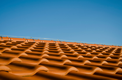 New brick roof; outdoor photography; natural sunlight used -after a storm, wet bricks.