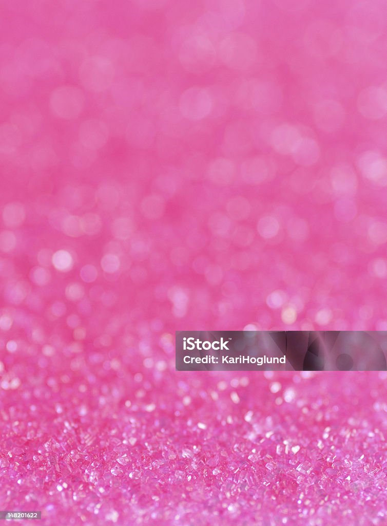 Close-up of pink sugar sparkles Pink sugar sparkle background with focus in the front Glowing Stock Photo