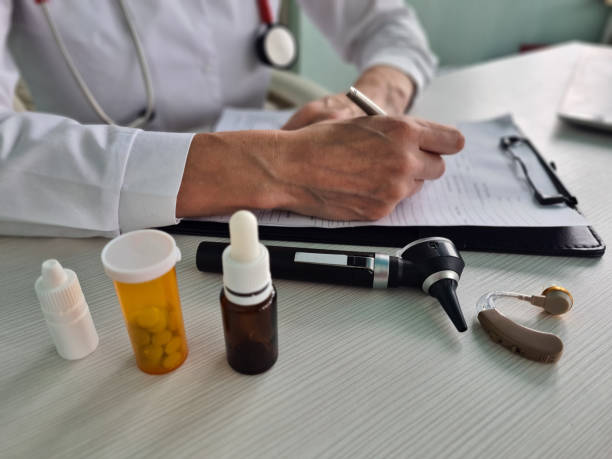 otolaryngologist-with-otoscope-writes-prescription-for-antibiotic-drops-and-tablets.jpg?s=612x612&w=0&k=20&c=5SQCOCv59Abb9sWem0xrT8lFaONxoUlNXWTqR7CJYHU=