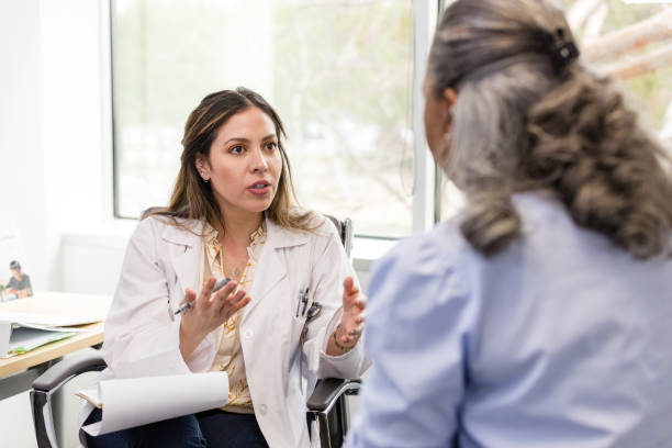 istock Female doctor gestures while explaining her proposal for treatment to the female patient 1482018574