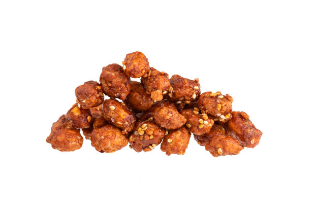 istock Roasted peanut with caramel coating and white sesame seeds - Arachis hypogaea 1482020122