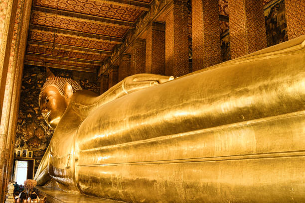 The giant reclining Buddha of Wat Pho The statue of the gold plated reclining Buddha in Wat Pho (Bangkok), the largest in Thailand. association of southeast asian nations photos stock pictures, royalty-free photos & images