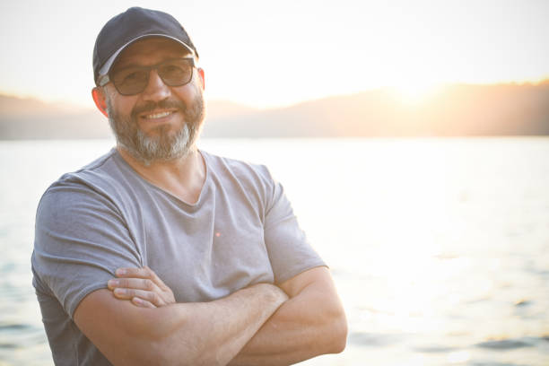 istock mature adult man resting on the beach 1482030182
