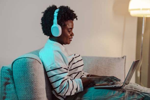 istock Young woman having a relaxing night at home and watching online content 1482031036