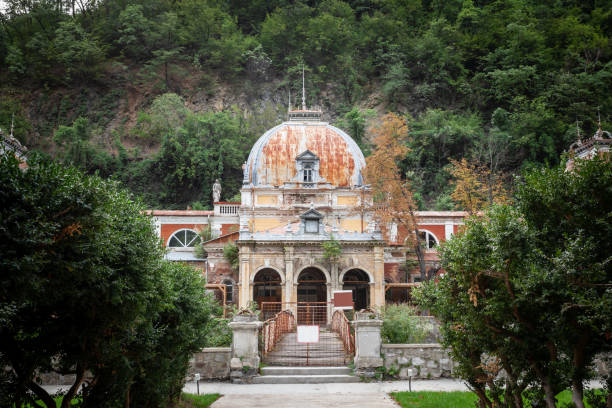 Picture of an abandoned decayed building, in ruin, belonging to the spa facility of Baile herculane, in Romania. Baile Herculane is a spa town in Romanian Banat, in Caraș-Severin County, situated in the valley of the Cerna River, between the Mehedinți Mountains to the east and the Cerna Mountains to the west, elevation 168 meters. Its current population is approximately 5,000.