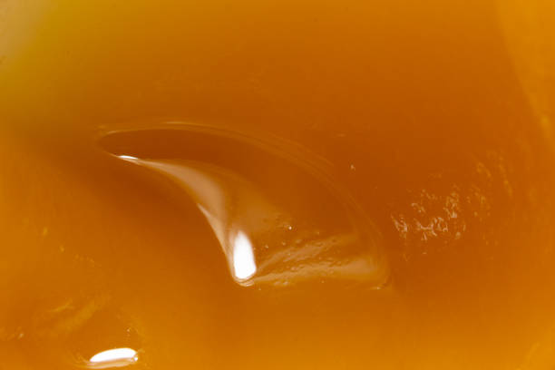 istock Honey orange textured background, close-up macro view 1482038482