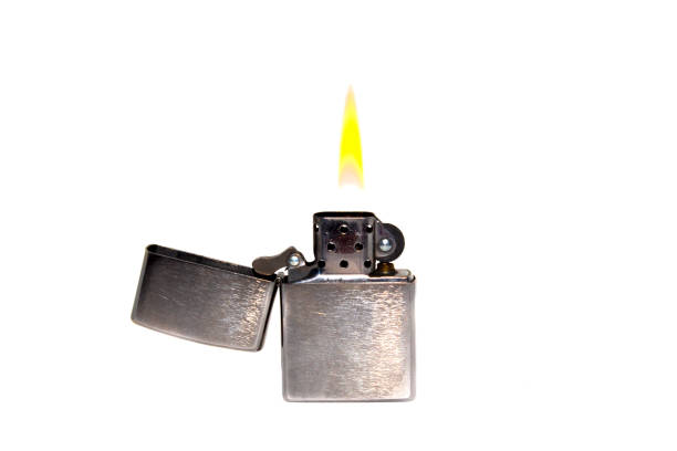 istock Metal petrol lighter with fire on a white background 1482039156