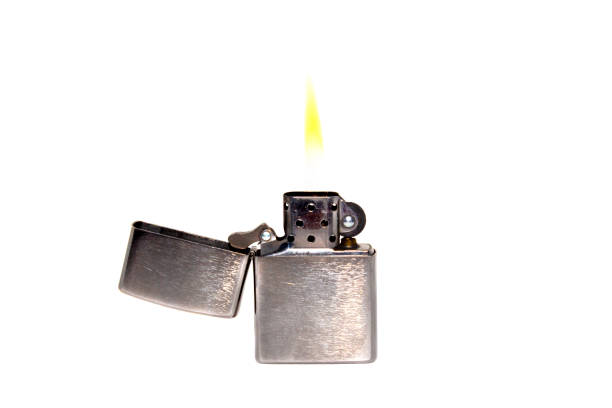 istock Metal petrol lighter with fire on a white background 1482039157