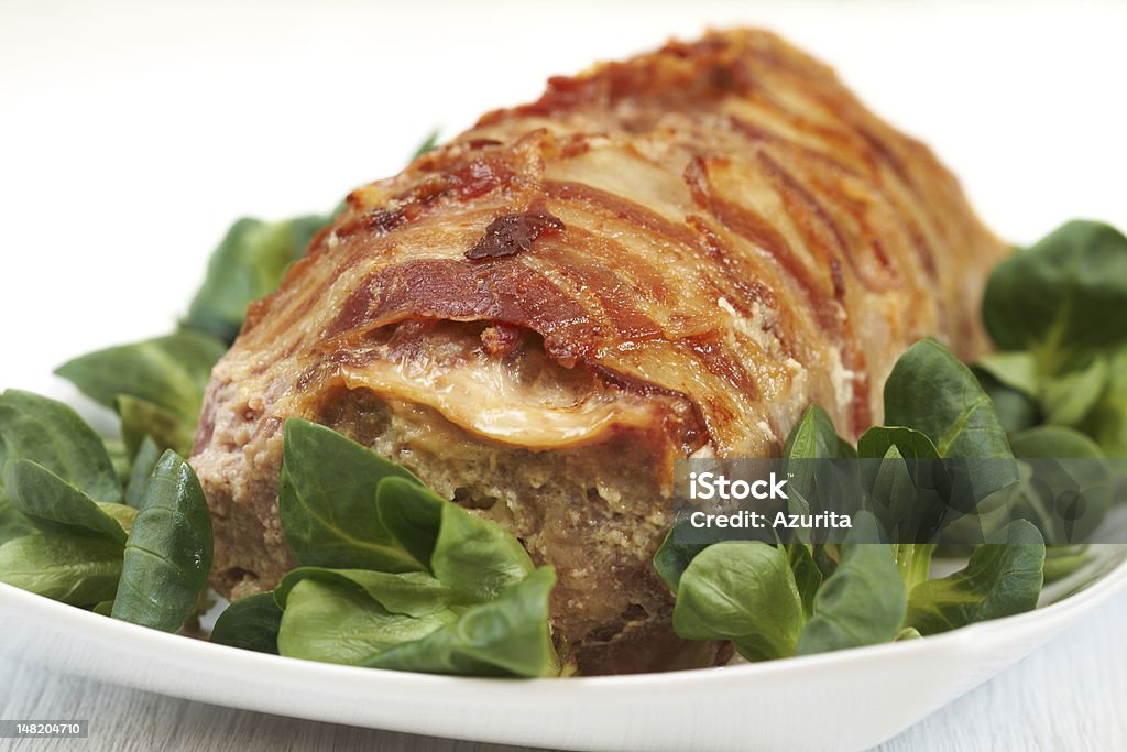 Meatloaf with bacon Meatloaf (beef, pork) with bacon on white Baked Stock Photo