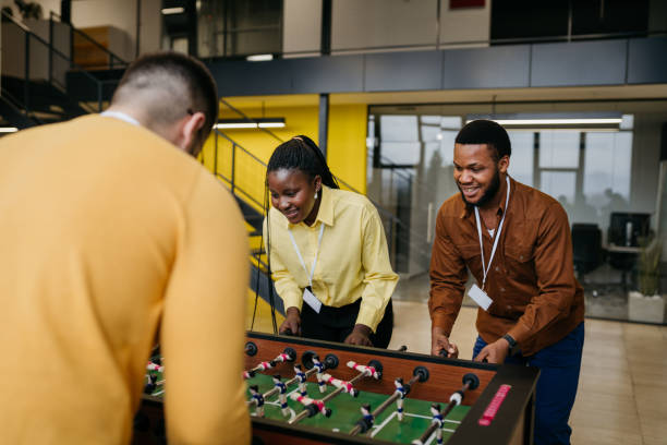 Business Colleagues Playing Table Football stock photo