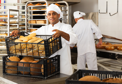 portrait of latino male baker in bakery