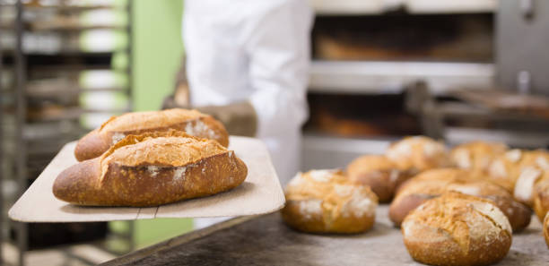 istock Freshly baked bread on peel in bakery 1482057207