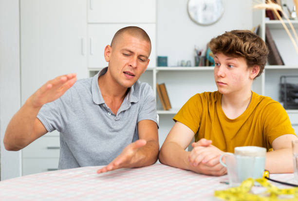 istock Man with his son are talking about life together at home 1482059285