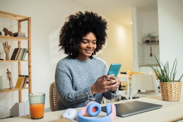 istock Young woman is using a smartphone 1482059676