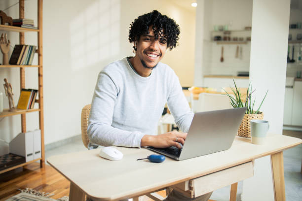 istock African American man is using a laptop at home 1482059808