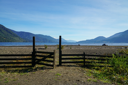 Beautiful image of a fence in beach in a lake