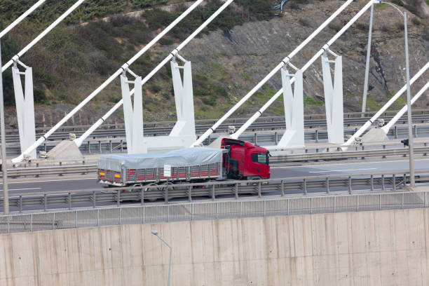 istock Truck Driving over bridge 1482060018