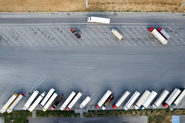 istock Trucks on a parking lot. Rest Area on a highway road 1482061033